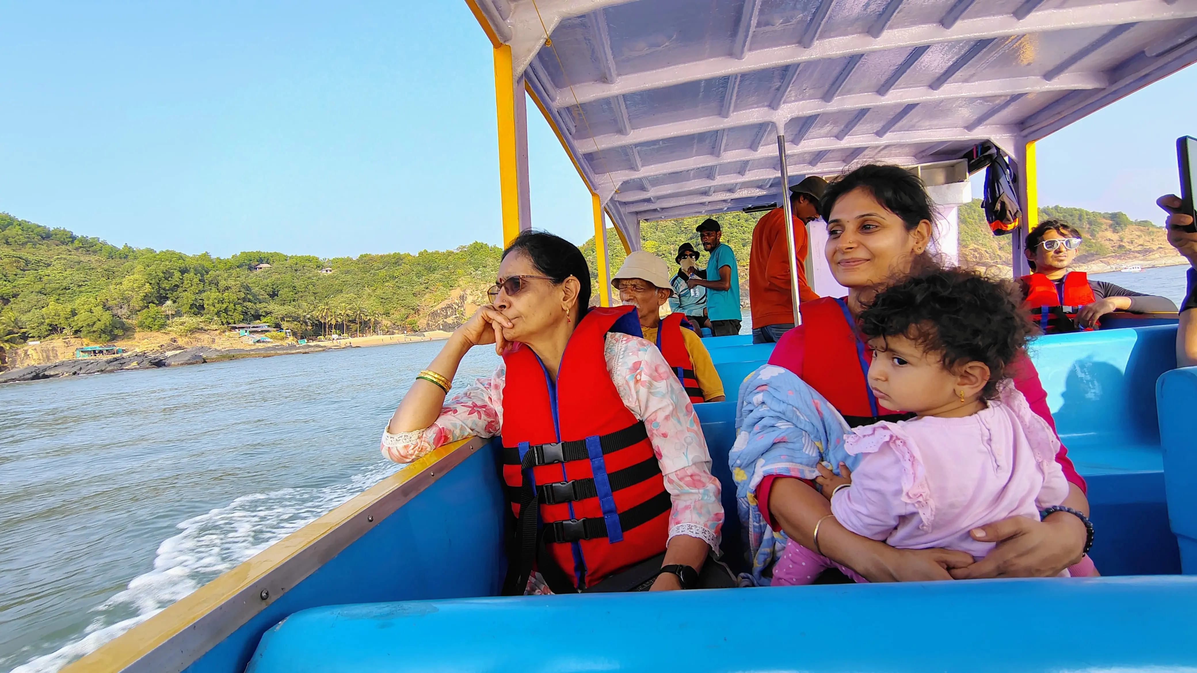 Tourists enjoying boat ride at Paradise Beach Gokarna
